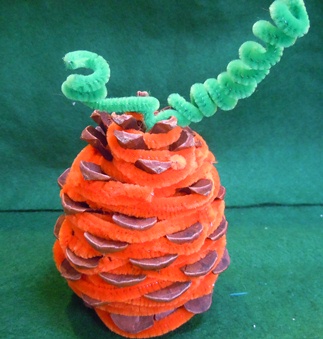 pine cone crafts; pine cone pumpkin